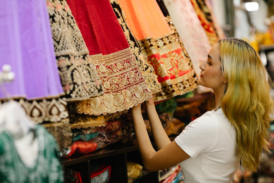 woman browsing colorful dresses in a boutique