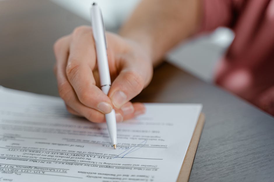 woman signing business documents with city view background