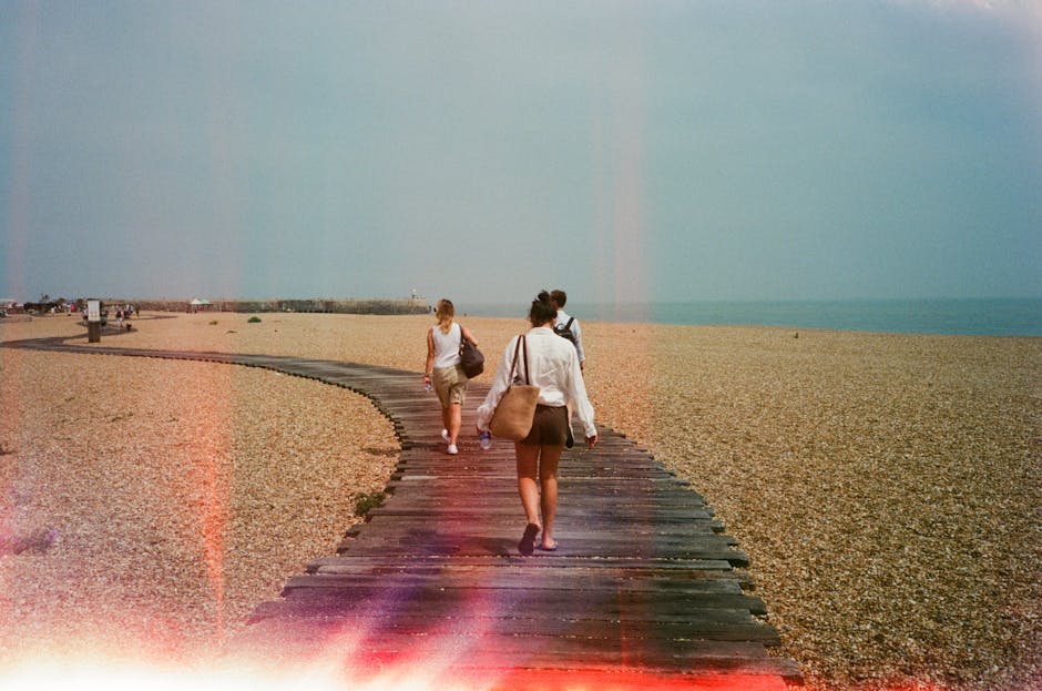 woman walking on beach boardwalk wearing colorful sandals