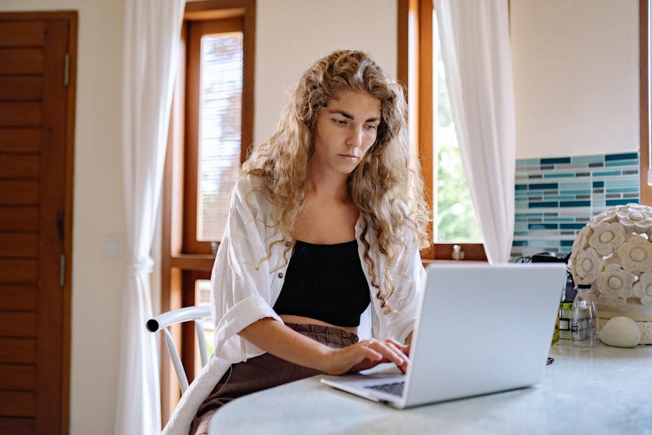woman working remotely from home with laptop