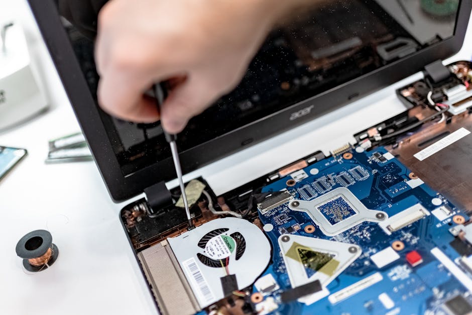 open laptop interior showing modular components and removable parts