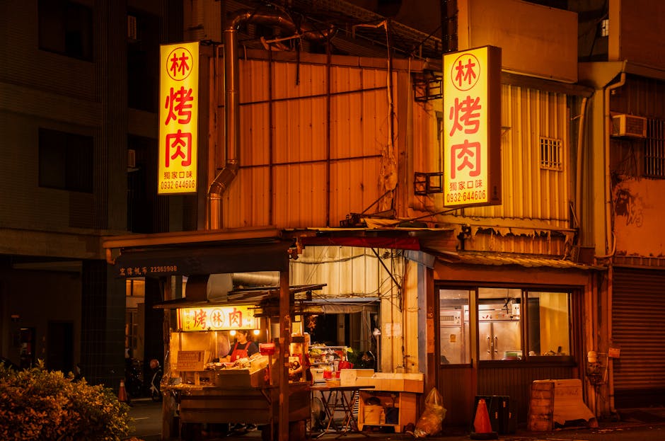 street food kebab stall with neon signs at night