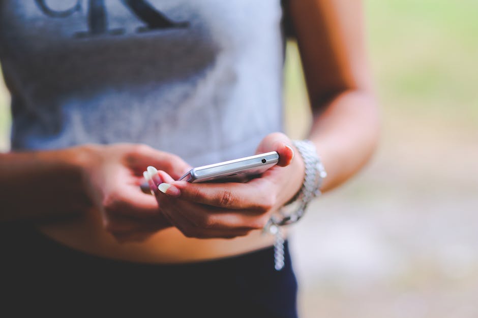 young woman scrolling social media on smartphone in Brazil